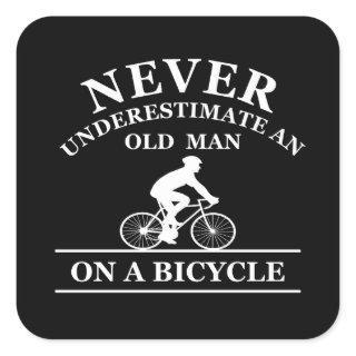 never underestimate an old man on a bicycle square sticker