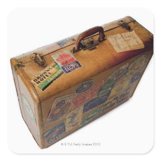 old fashioned suitcase with travel stickers