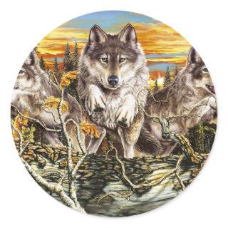 Pack of wolves jumping over a log classic round sticker