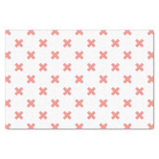 Peach cross stitches on white tissue paper