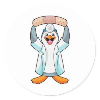 Penguin as Doctor with Plaster Classic Round Sticker