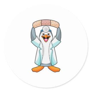 Penguin as Doctor with Plaster Classic Round Sticker