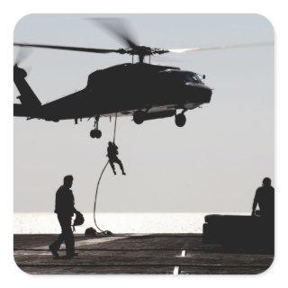 Personnel fast-rope out of an SH-60F Square Sticker