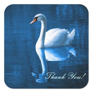 Pretty white swan floating on a blue lake square sticker