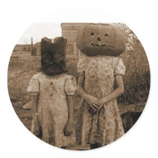 Pumpkin girl with the black sack classic round sticker