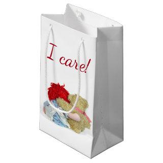 rag doll and teddy bear hug on white small gift bag