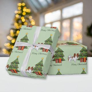 Red And White Papillon Dog By A Christmas Tree