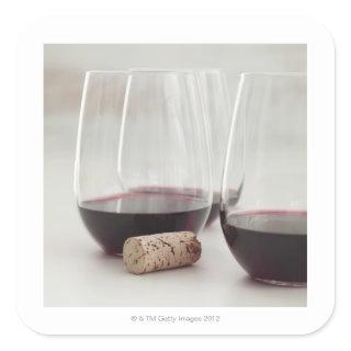 Red wine in stemless glasses square sticker