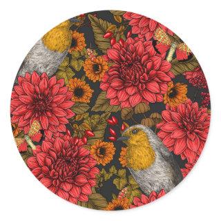 Robins in the autumn garden, red dahlias on black classic round sticker