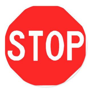 Round sticker with Stop sign.