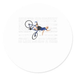 Running the country is like riding a bike, funny b classic round sticker