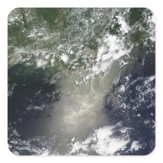 Satellite view of streaks and ribbons of oil square sticker