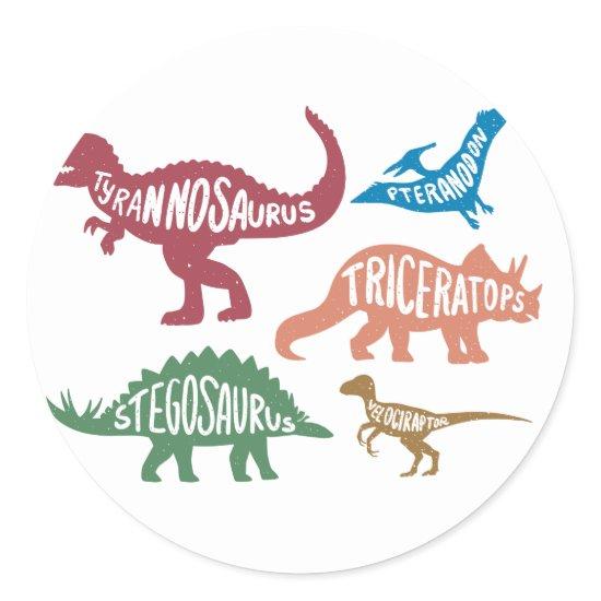 Set of silhouettes of different dinosaurs classic round sticker