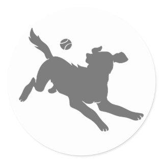 Silhouette of dog with ball classic round sticker