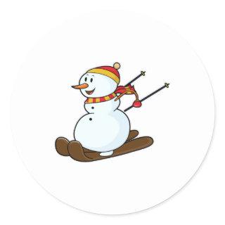 Snowman as Skier with Skis & Cap Classic Round Sticker