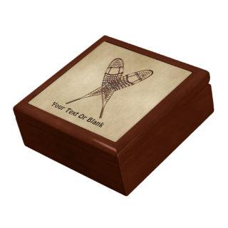 Snowshoes On Old Paper Gift Box