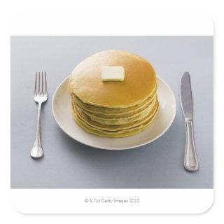 Stack of pancakes with butter on a plate square sticker