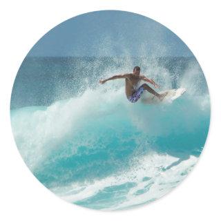 Surfer on a big wave round sticker