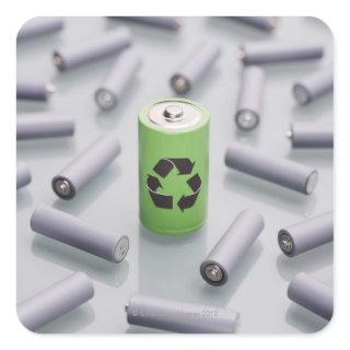 Surrounded by smaller grey batteries. square sticker