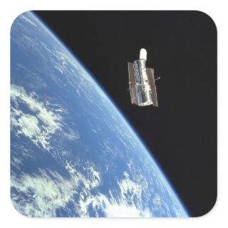 The Hubble Space Telescope with a blue earth Square Sticker