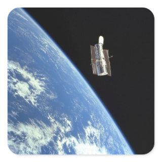 The Hubble Space Telescope with a blue earth Square Sticker