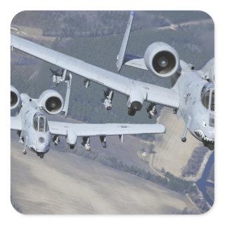 Two A-10C Thunderbolt II aircraft fly in format Square Sticker