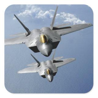 Two F-22 Raptors fly over the Pacific Ocean Square Sticker