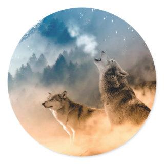 Two wolves howl at the full moon in forest classic round sticker