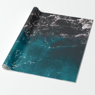 Wavy foamy blue black ombre sea water