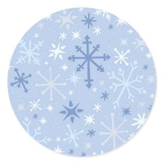 Whimsical snowflake flurry in icy blues classic round sticker