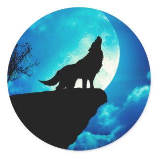 Wolf in silhouette howling to the full moon classic round sticker