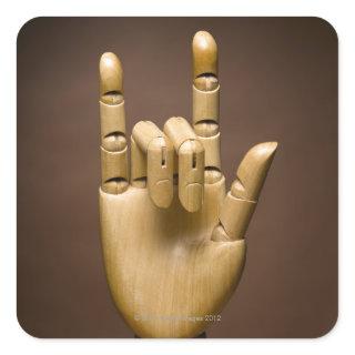 Wooden hand index and small finger extended, square sticker