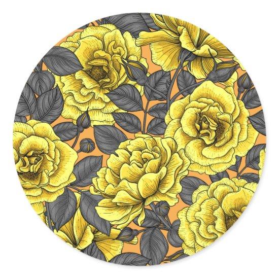 Yellow roses with gray leaves on orange classic round sticker